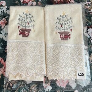 Two embroidered Christmas hand towels